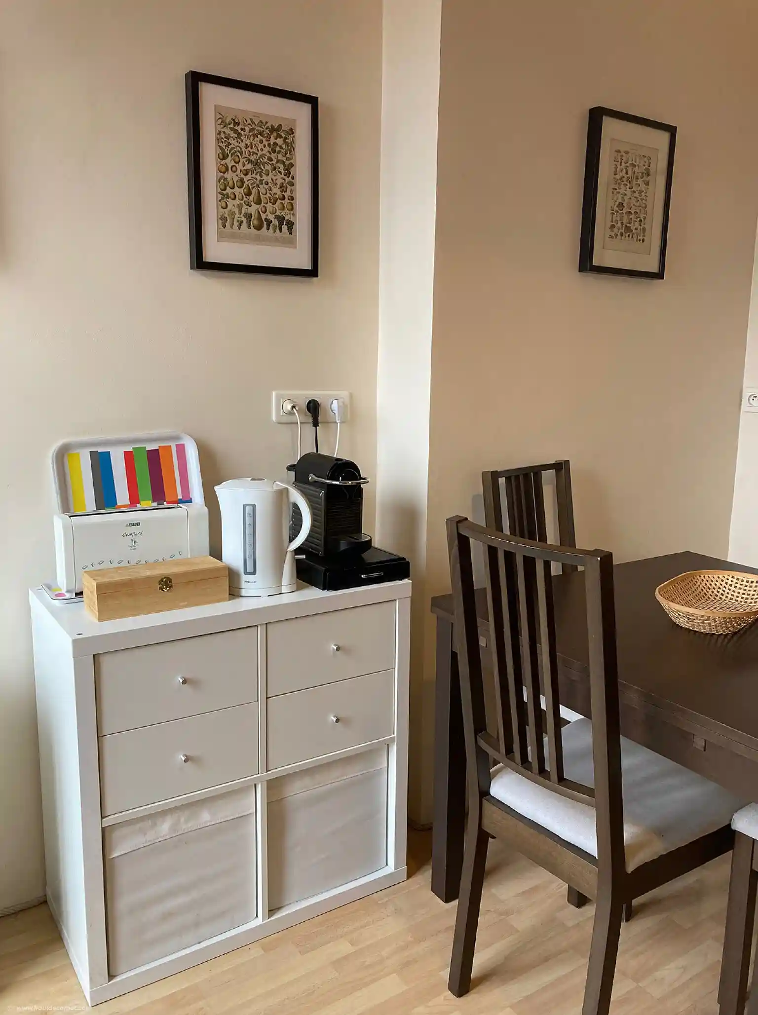 View of the kitchen showing the breakfast hub with toaster, electric kettle, Nespresso machine and a large table with 4 chairs