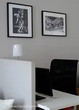 View of the workplace showing a desk, screen, keyboard and comfortable desk chair